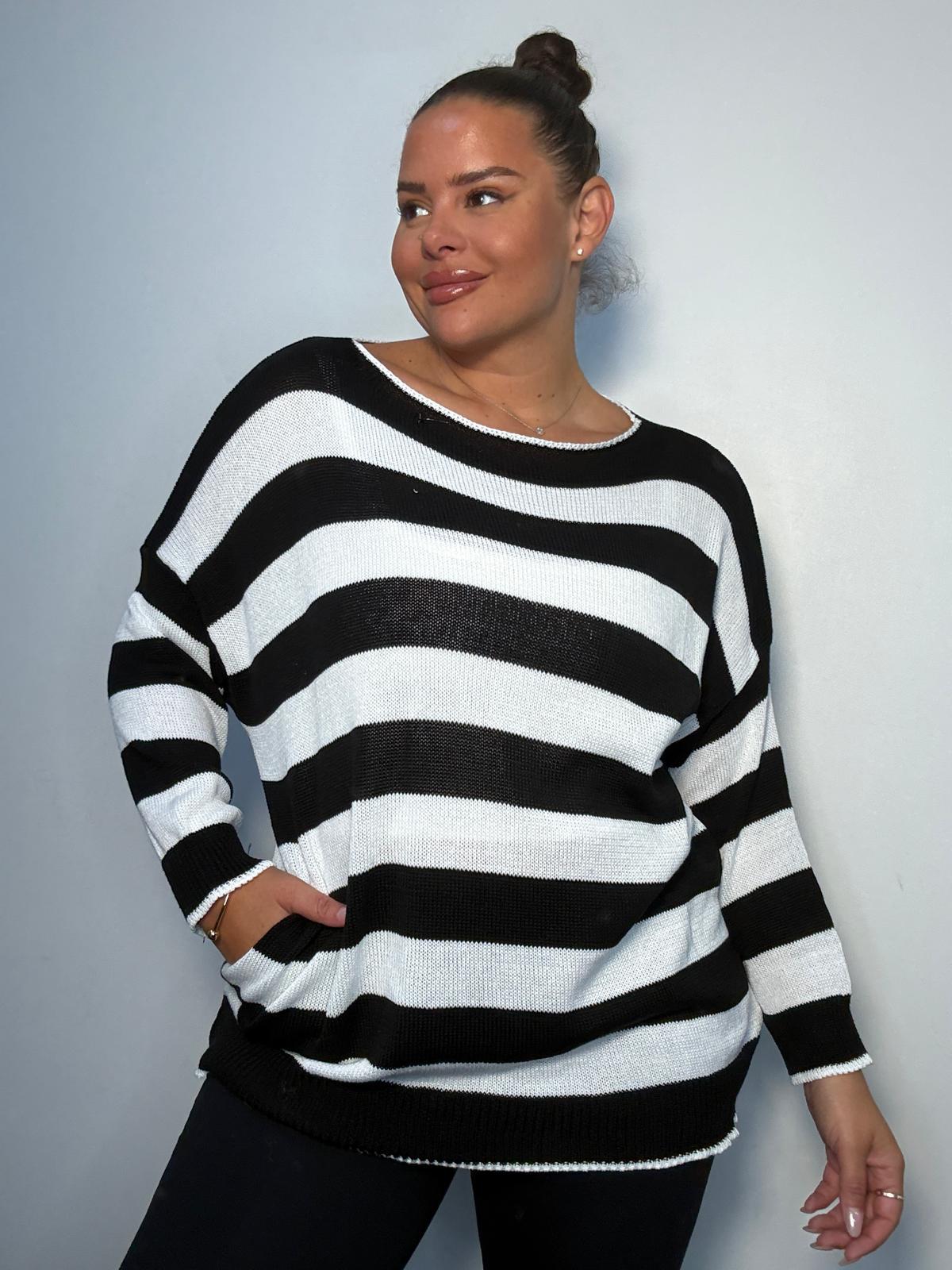 Plus Size Model wearing black and white striped jumper showing the jumper from the front