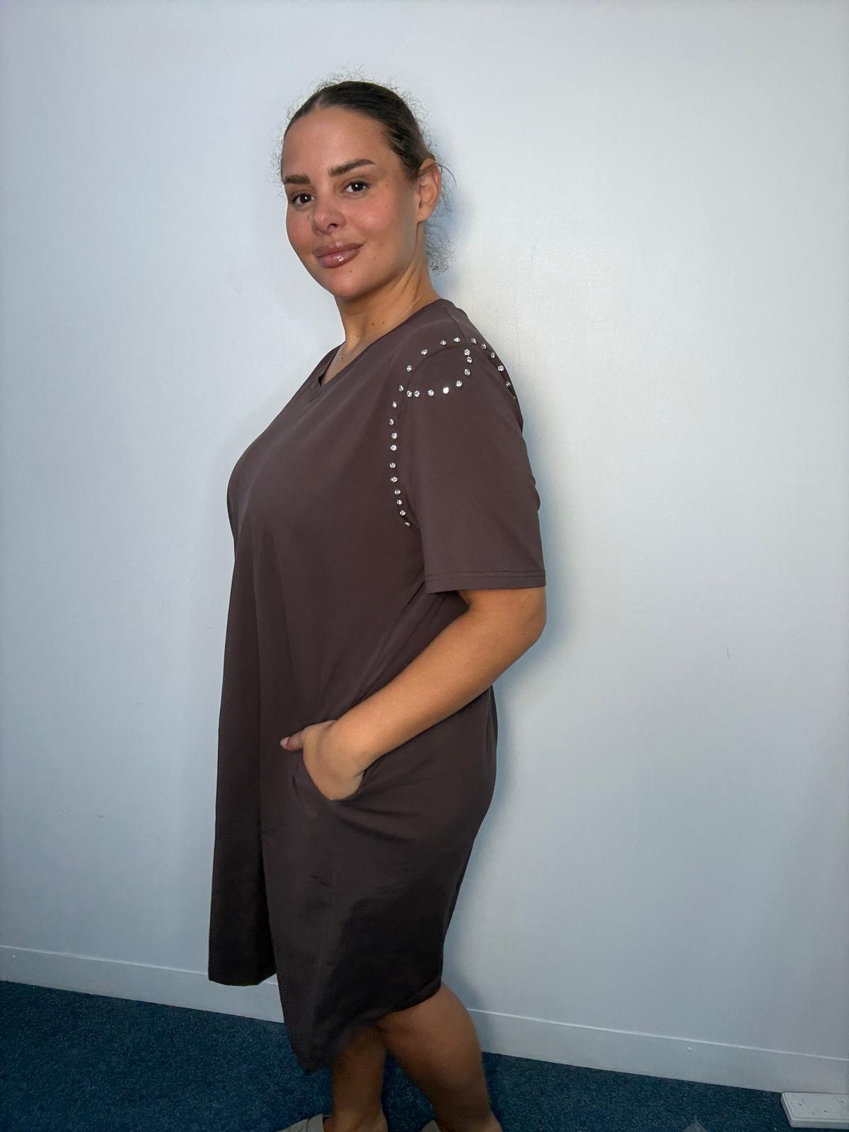 Side view of a chocolate brown plus-size midi dress featuring diamante-style shoulder detailing, short sleeves and side pocket.