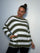 Plus Size Model wearing khaki and white striped jumper showing the jumper from the front