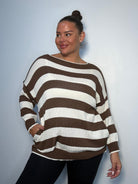 Plus Size Model wearing brown and white striped jumper showing the jumper from the front