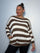 Plus Size Model wearing brown and white striped jumper showing the jumper from the front